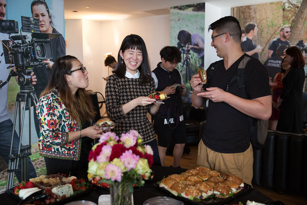 three people eating at the 2016 nyfa fall film commencement ceremony