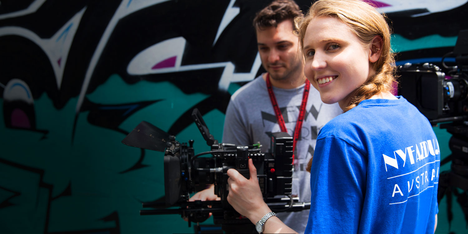 man and woman working on film set