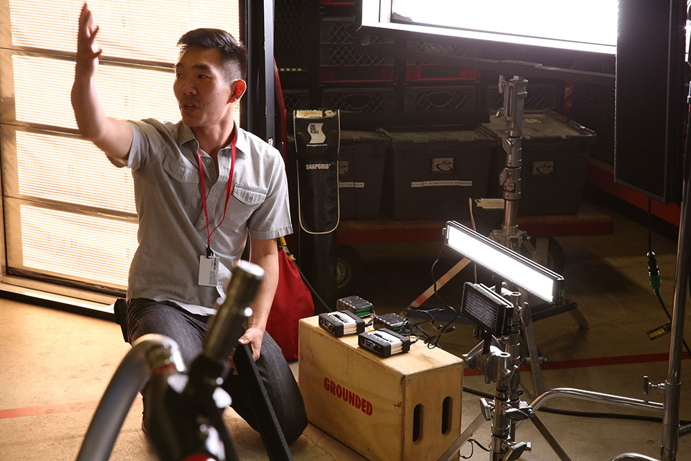 Tour guide from Grounded Tour explaining film equipment inside the trailer to NYFA class.