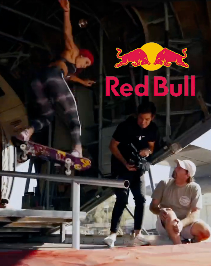 Women Skateboarding while being filmed in a Red Bull video shoot.